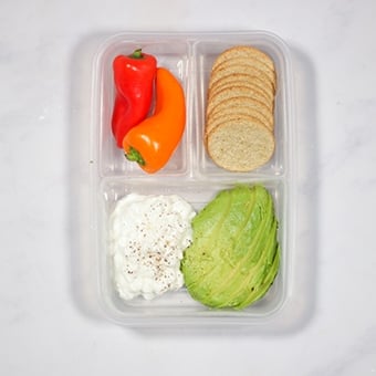 plastic lunchbox with avocado and cottage cheese, healthy lunch idea for work