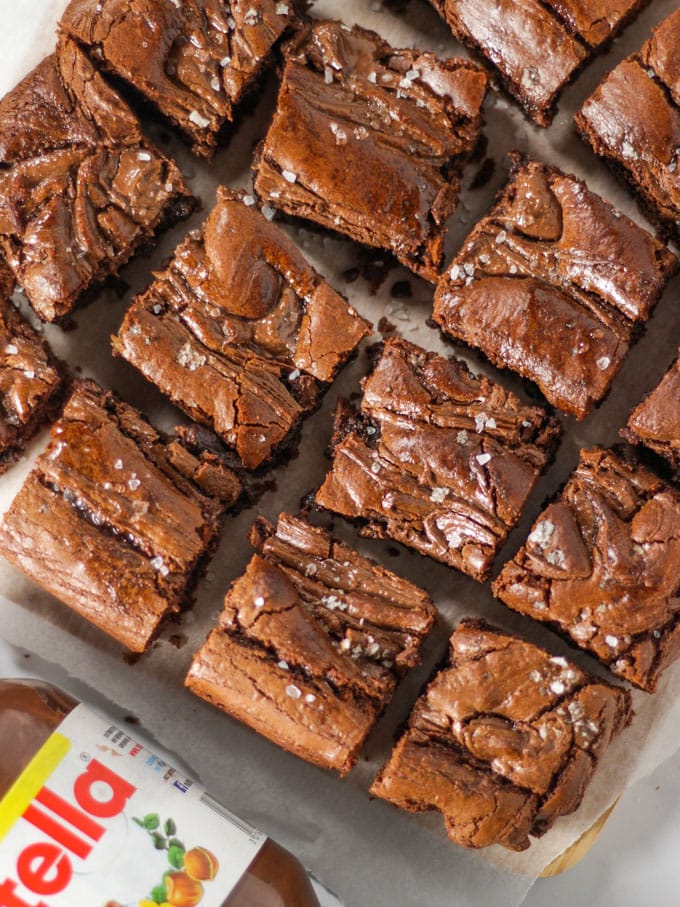 Chocolate brownies with jar of Nutella