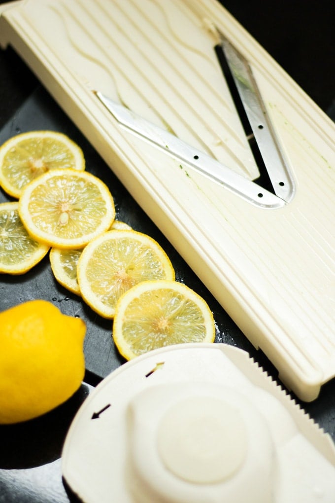 Mandolin with lemon slices.