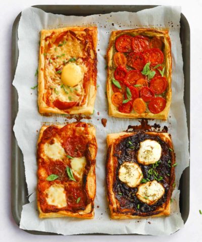 Easy puff pastry tarts with tomatoes, cheese, goats cheese, caramelised onions and bacon