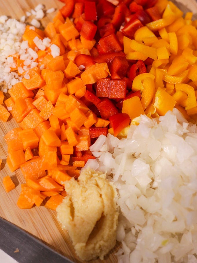 Chopped cubes of carrot, pepper, onion, garlic and ginger paste. Step 1 of how to make Egg Fried Rice.