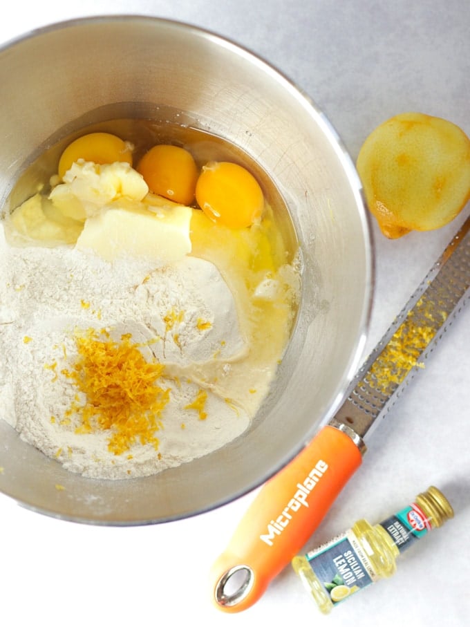 Egg, flour, butter and cake batter ingredients in a kitchen aid mixer bowl