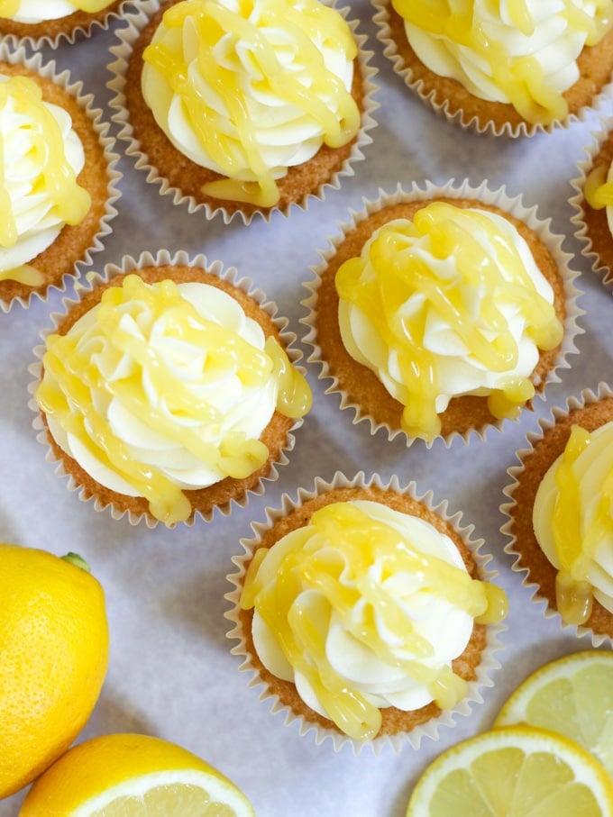 Tops of lemon cupcakes with zesty moist drizzle