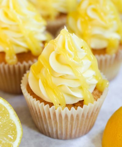 lemon drizzle cupcakes with lemon icing and lemon curd on top
