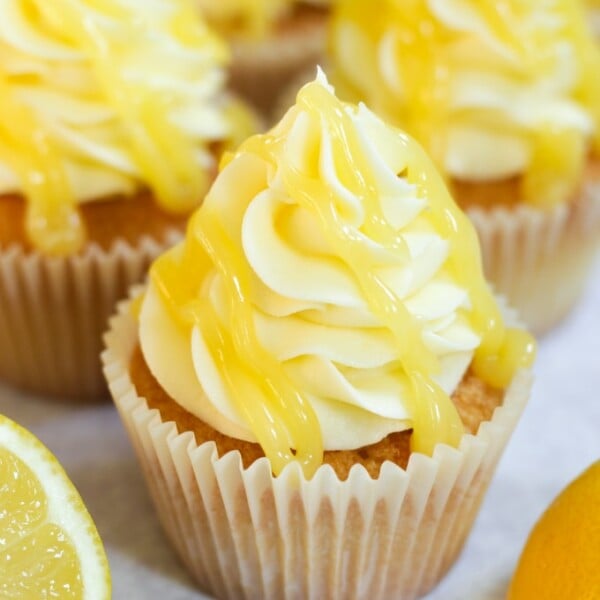 lemon drizzle cupcakes with lemon icing and lemon curd on top