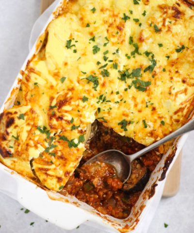 Vegetable Moussaka bake recipe in a white dish with spoon
