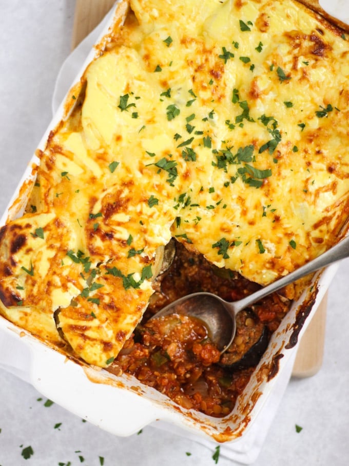 Vegetable Moussaka bake recipe in a white dish with spoon