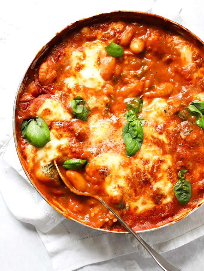 Tomato, basil and spinach gnocchi topped with parmesan cheese