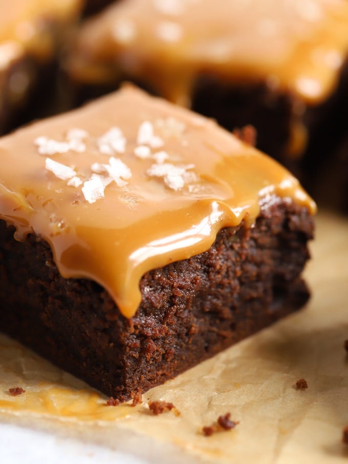A chocolate brownie topped with caramel and salt