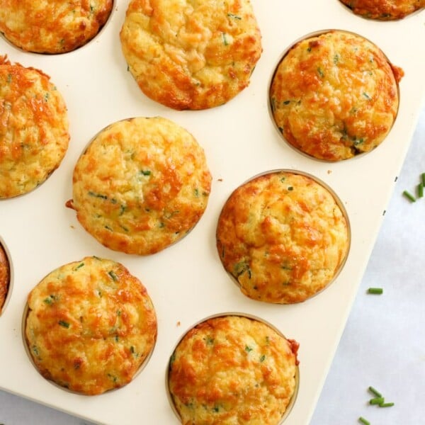 Easy savoury muffins topped with cheese and packed with corn