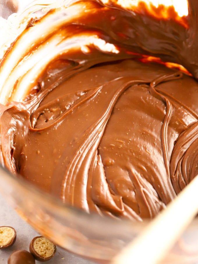 Melted chocolate in a glass bowl for step 1 in the recipe for Malteser Fudge.