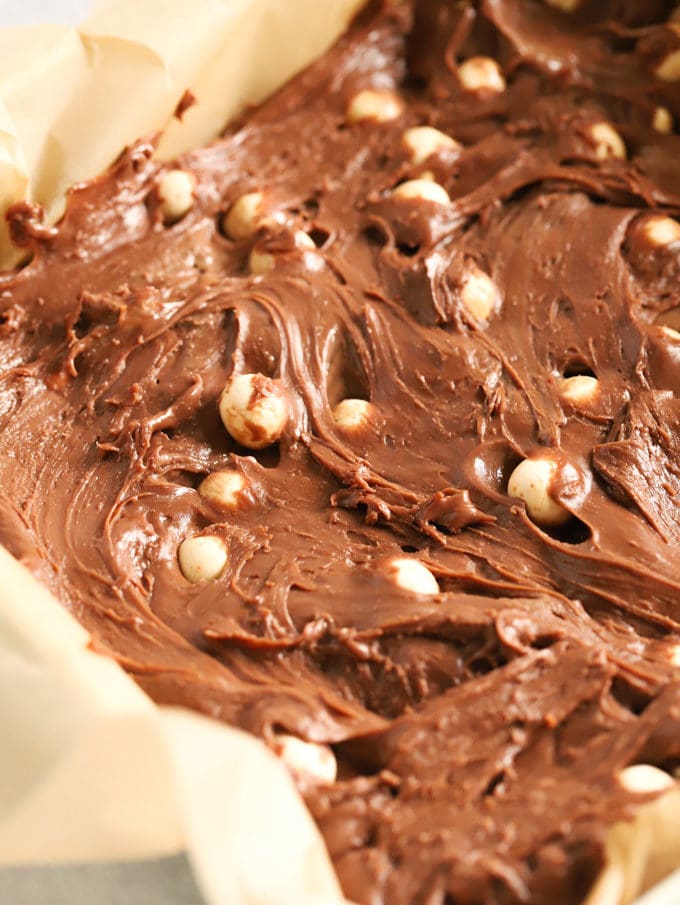 creamy chocolate fudge mixture studded with maltesers in a baking paper lined tin
