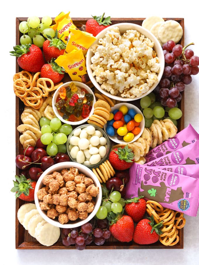 A large charcuterie board with cheeses, meats, crackers, and fruits, ideal for charcuterie board ideas for gatherings.