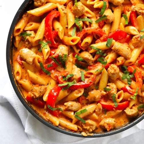 Easy sausage pasta recipe made in one pot with peppers, tomatoes and garlic