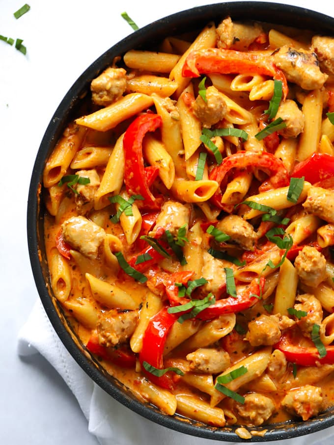 Easy sausage pasta recipe made in one pot with peppers, tomatoes and garlic.