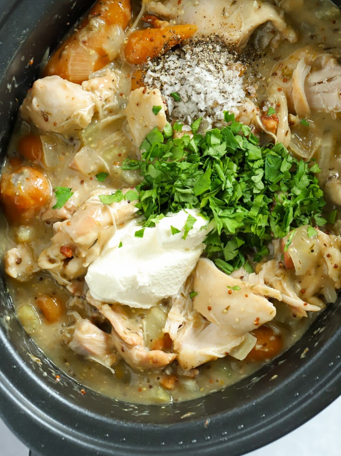 Chicken stew with herbs and creme fraiche on top