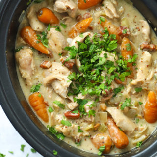 Easy slow cooker chicken casserole with bacon and carrots sprinkled with parsley