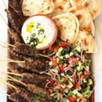 Lamb kofta kebabs recipe with flatbreads and Greek salad and tzatziki