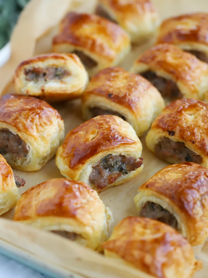 Small homemade sausage rolls with puff pastry
