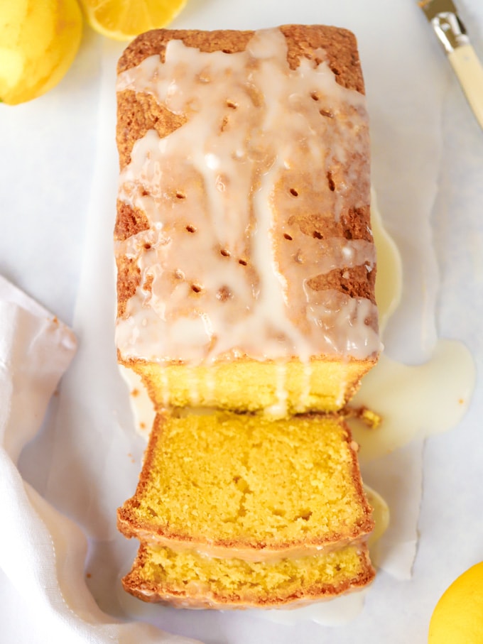 Moist sliced lemon drizzle cake with icing