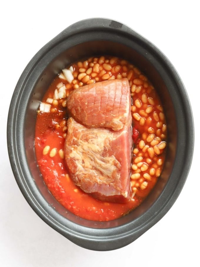 Uncooked ham in slow cooker with beans for the recipe Campfire Stew.