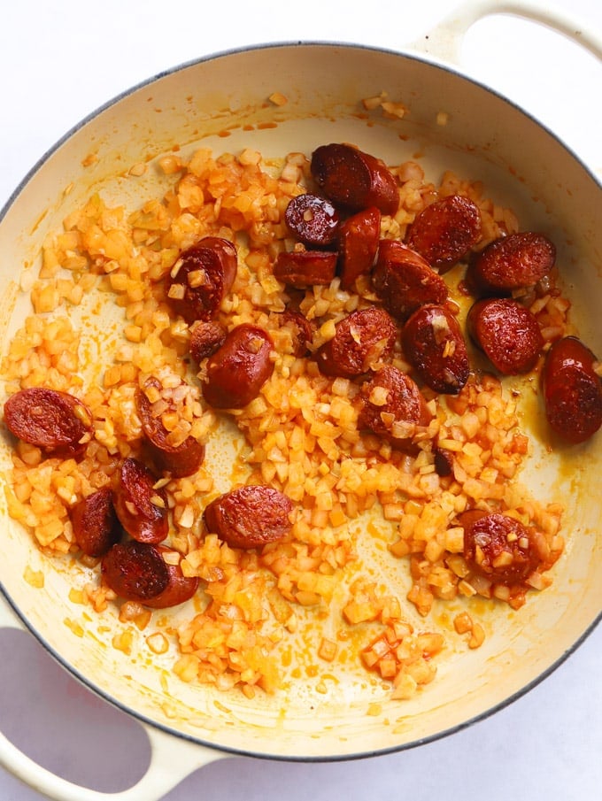 Chorizo onions and garlic frying in a pan