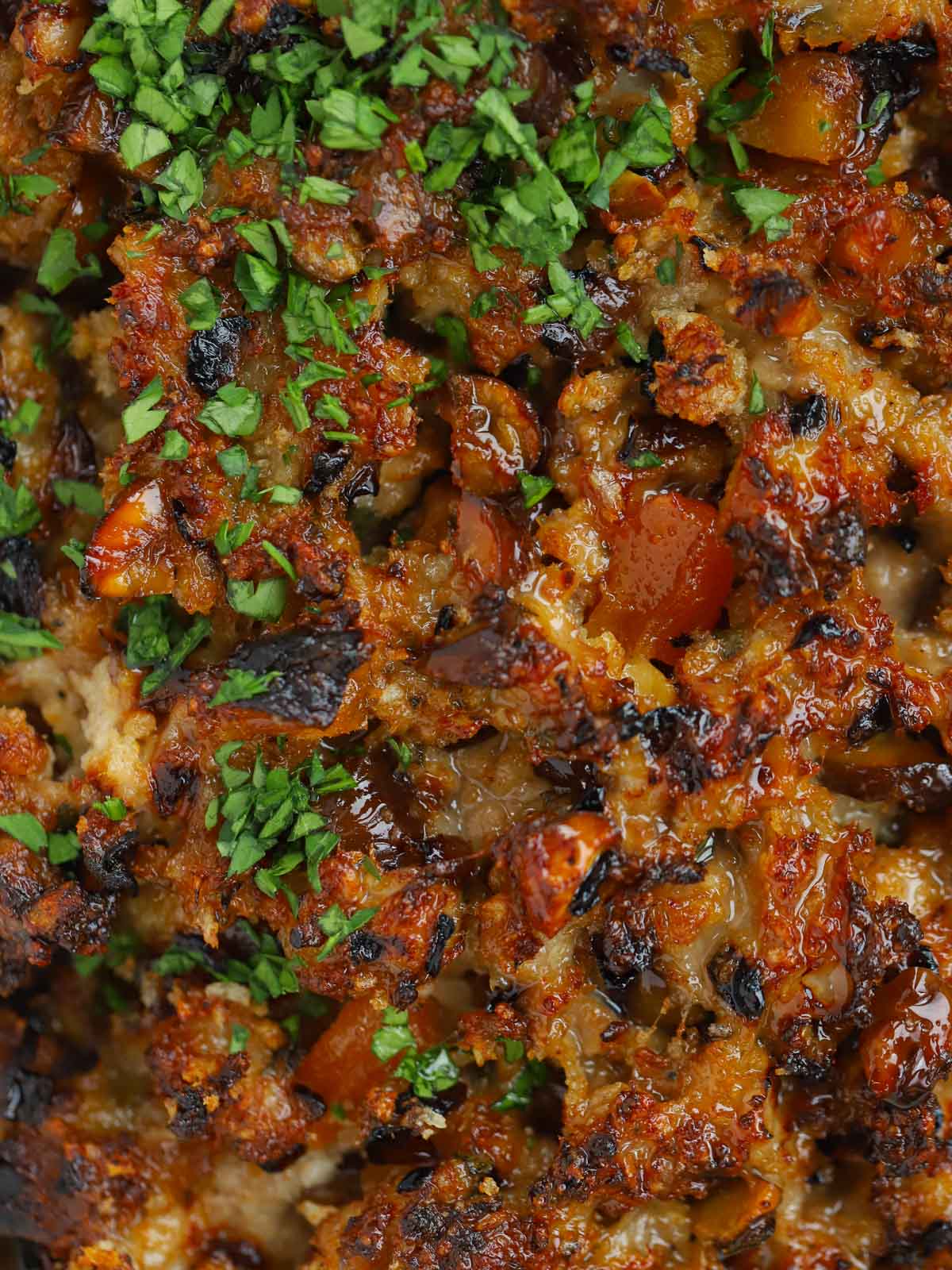 Close up photo of homemade sausage meat stuffing with apricots and chestnuts.