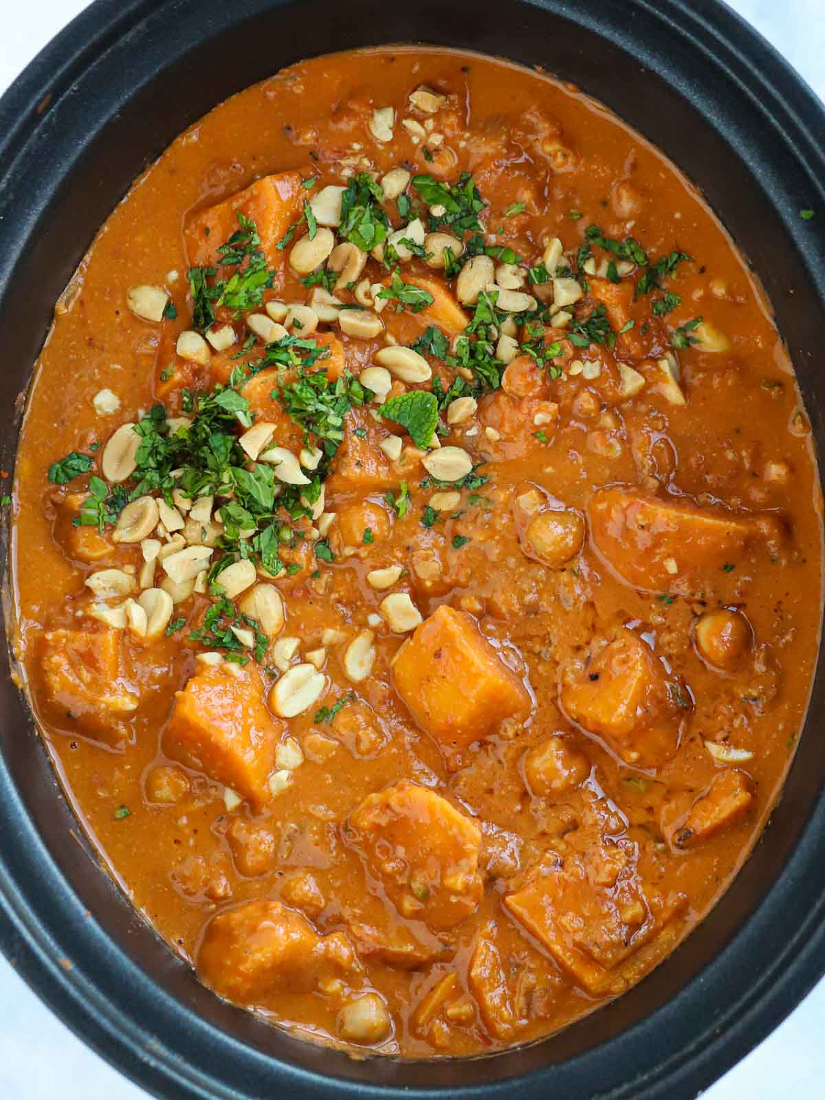 Sweet potato and peanut butter slow cooker vegan stew in the pan, ready to serve.