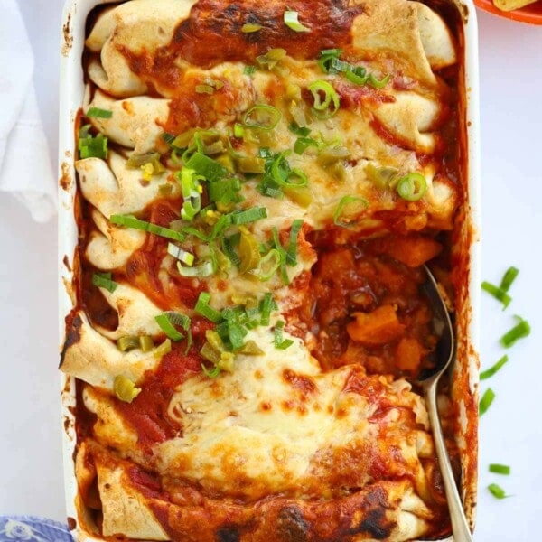Vegetarian Enchiladas with beans and roasted vegetables topped with cheese