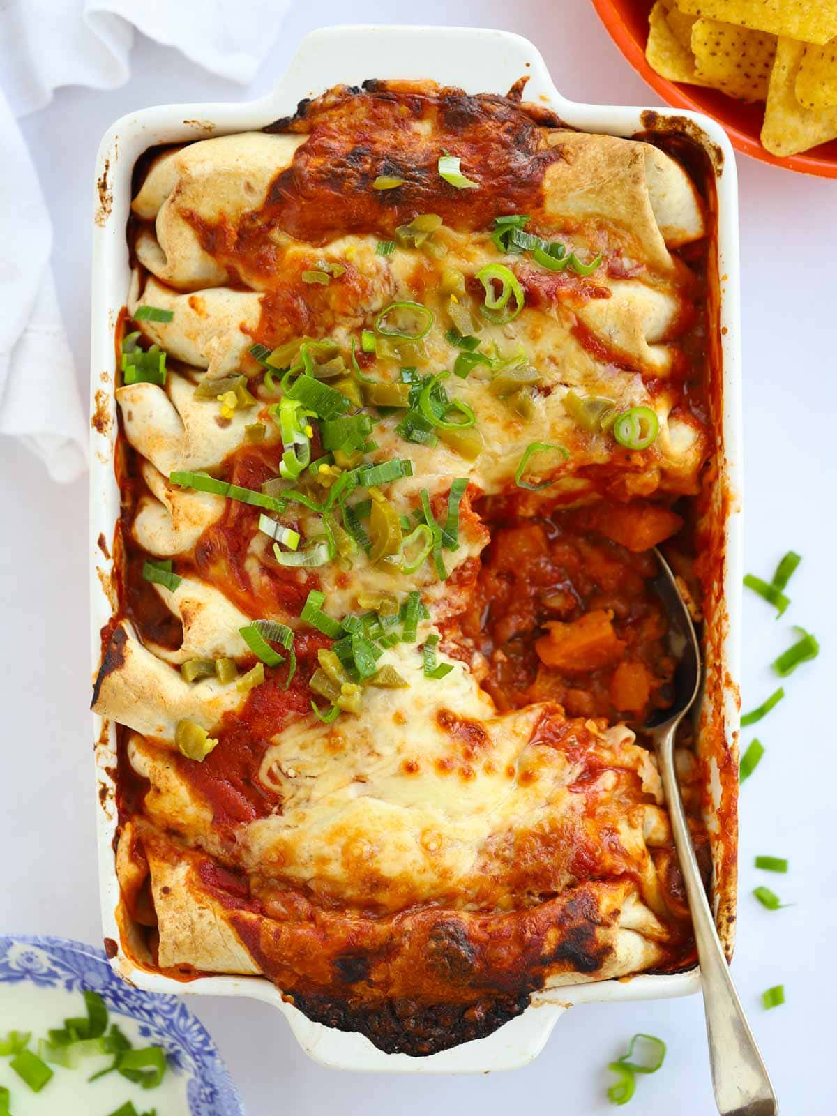 Vegetarian Enchiladas with beans and roasted vegetables topped with cheese