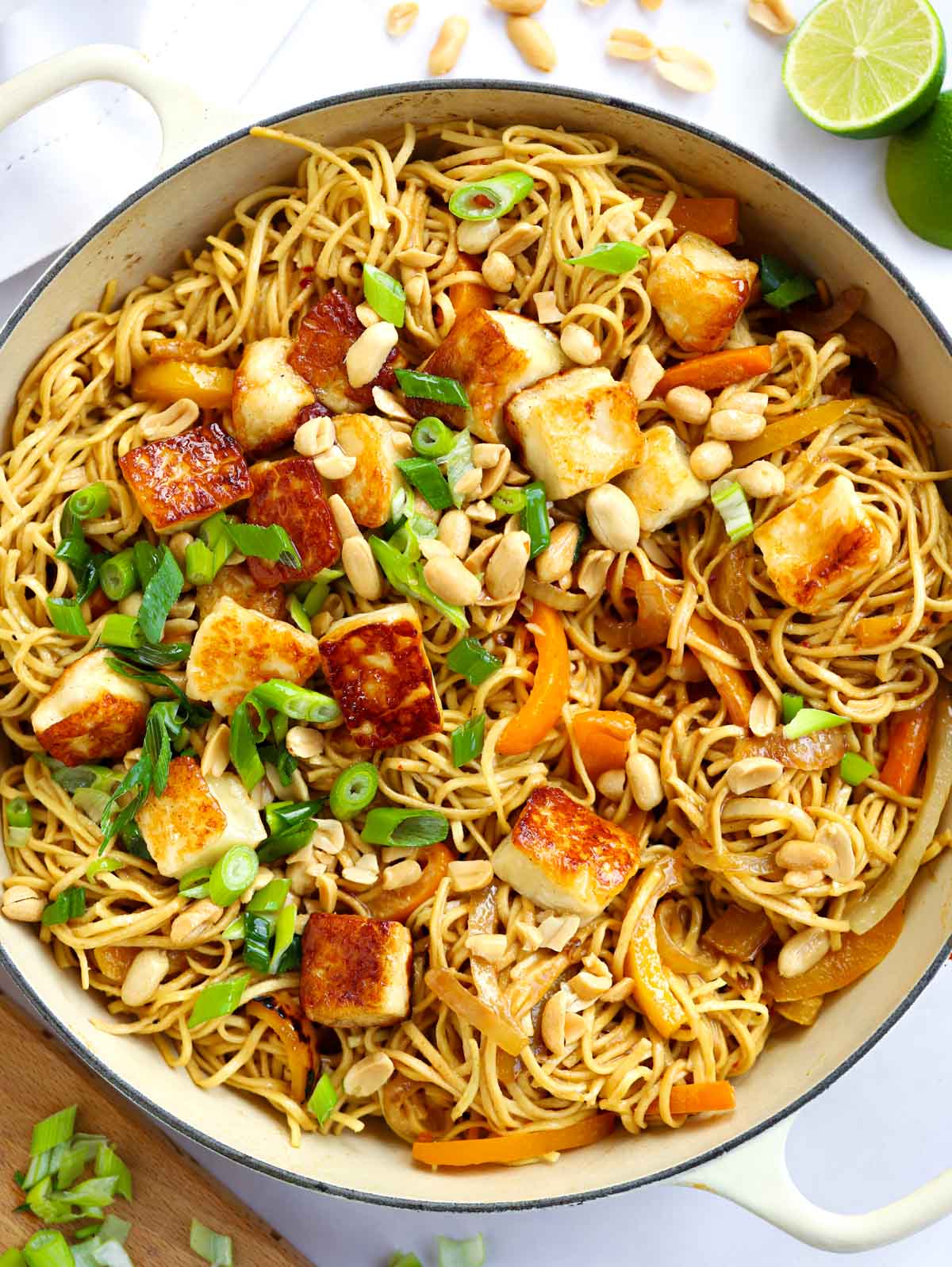 A big round pan filled with noodles and halloumi with a peanut butter satay-style sauce.