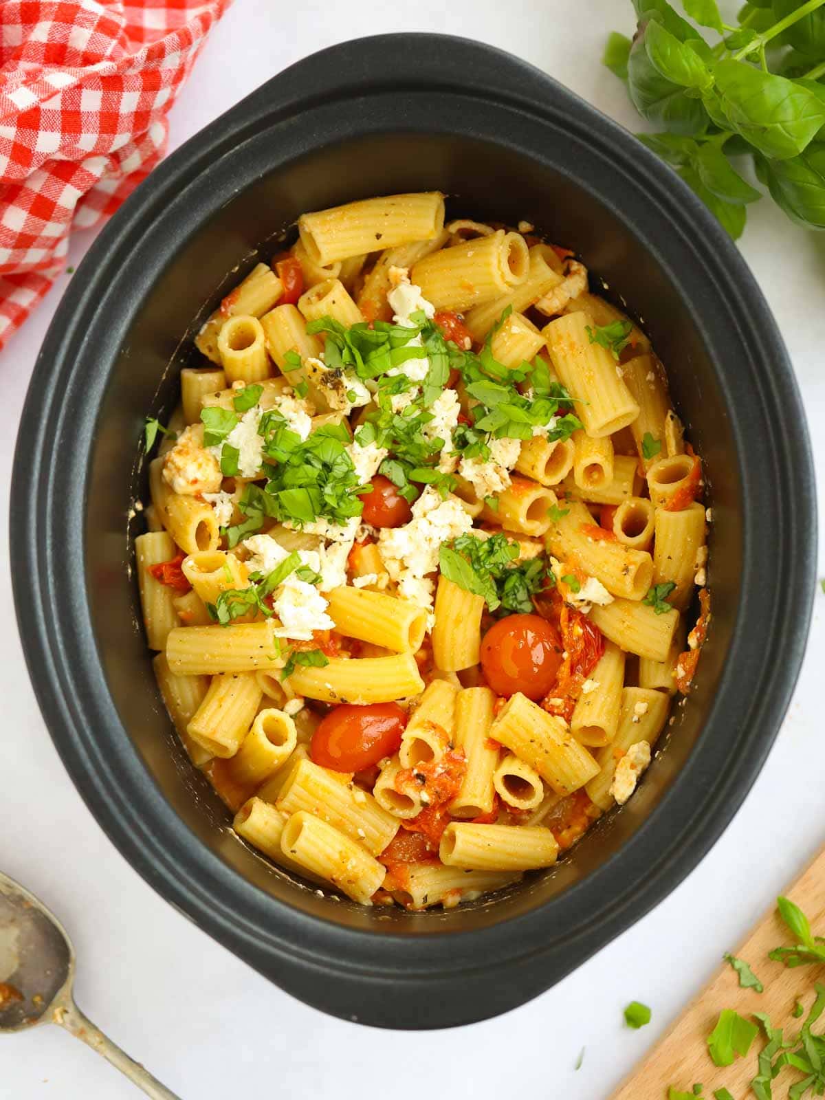 A slow cooker filled with Feta and Tomato Pasta for the viral Tik Tok recipe.