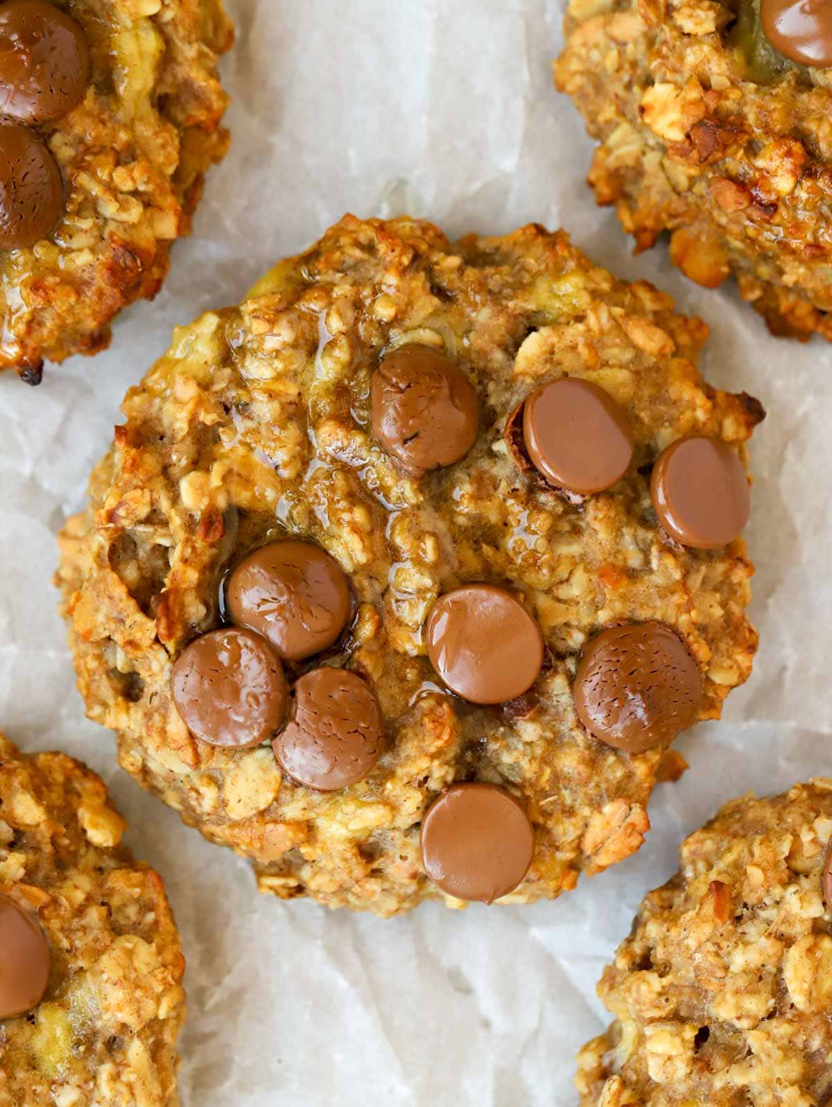 Close up of Peanut Butter Breakfast Cookie with choc chips on baking tray.