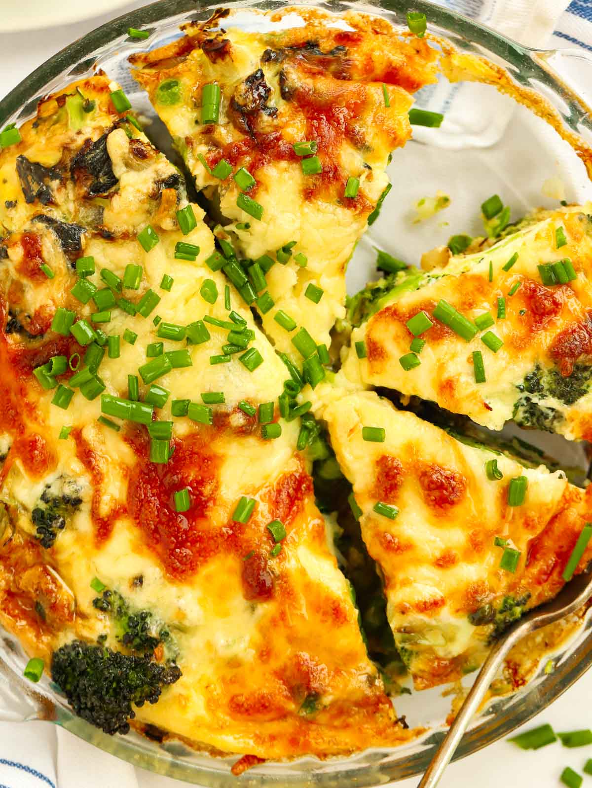 Slices of crustless quiche with vegetable and cheese filling.