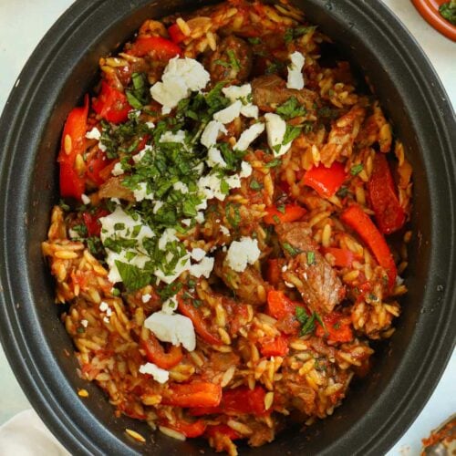 Orzo lamb casserole shown in the slow cooker