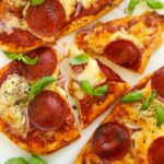 Delicious and easy naan bread pizzas topped with cheese and pepperoni