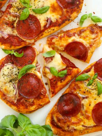 Delicious and easy naan bread pizzas topped with cheese and pepperoni