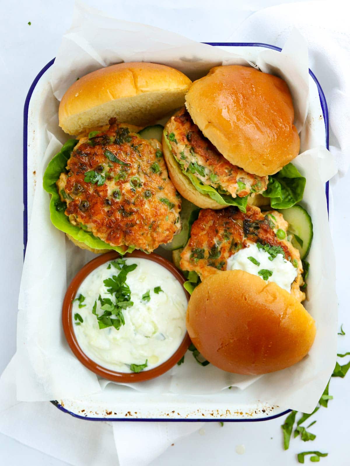 Salmon Burgers that have been homemade with a dressing