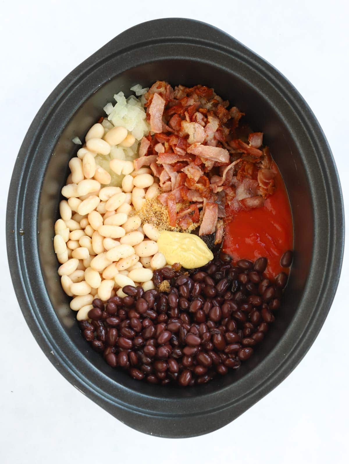 Raw ingredients for homemade baked beans cooked in the slow cooker