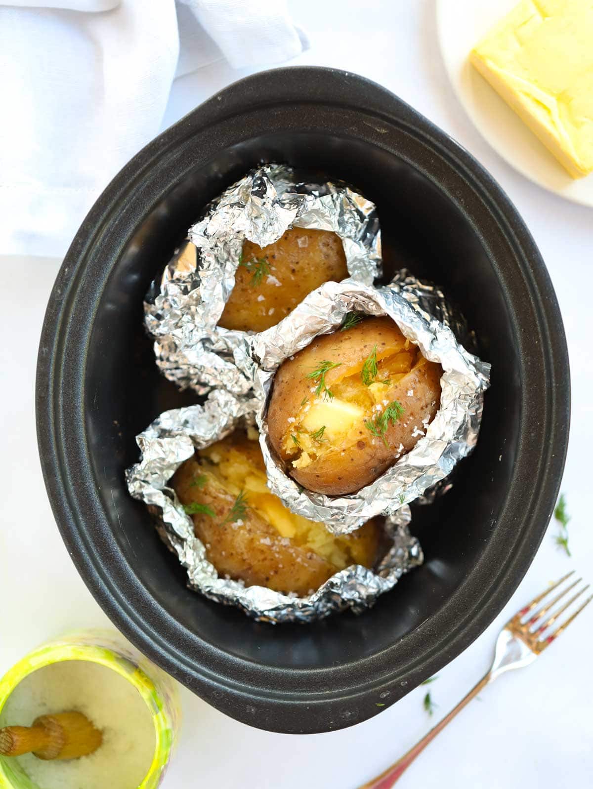 This recipe shows you how to easy it is to make slow cooker jacket potatoes