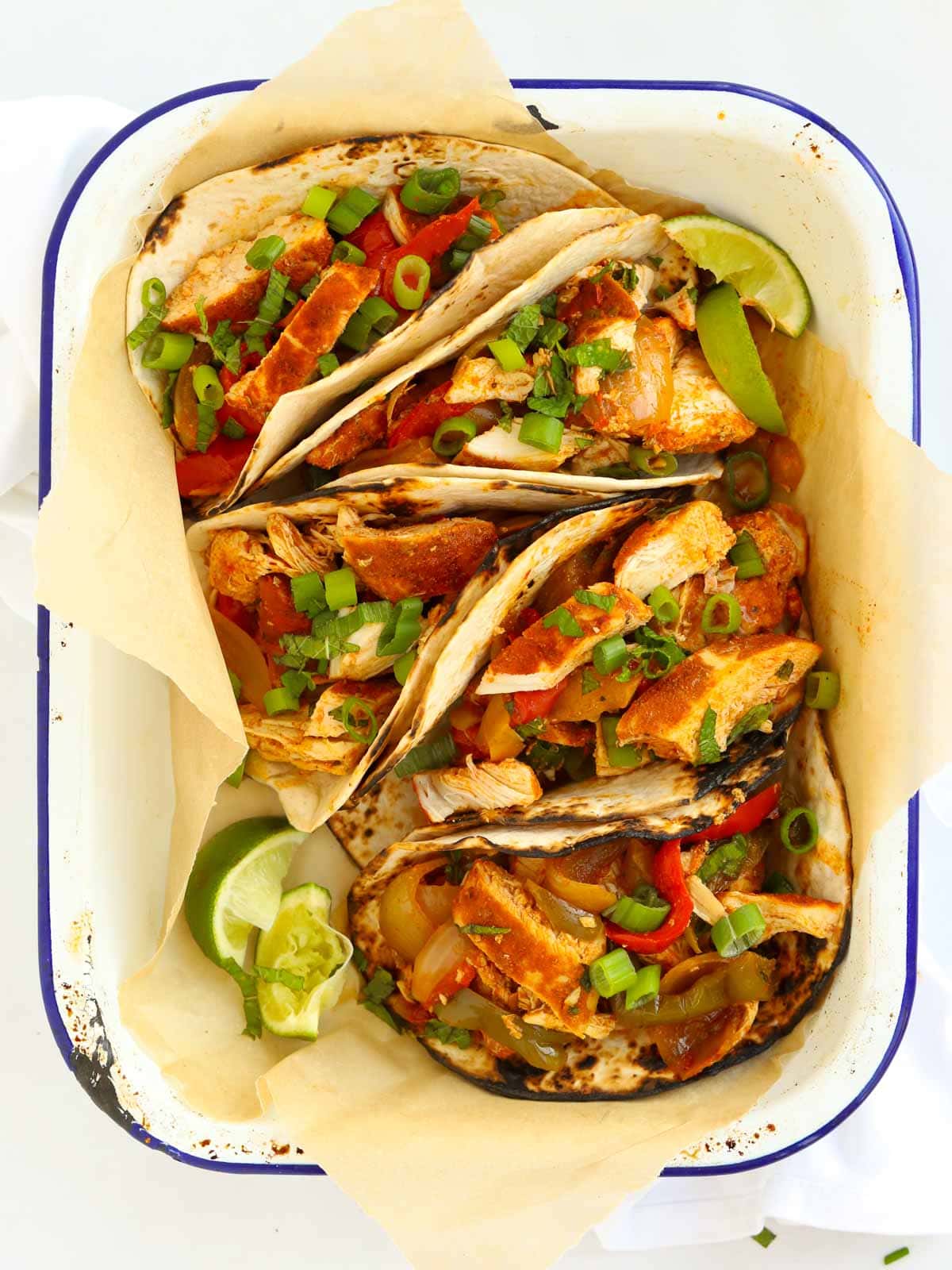Recipe for slow cooker chicken fajitas, served in wraps.