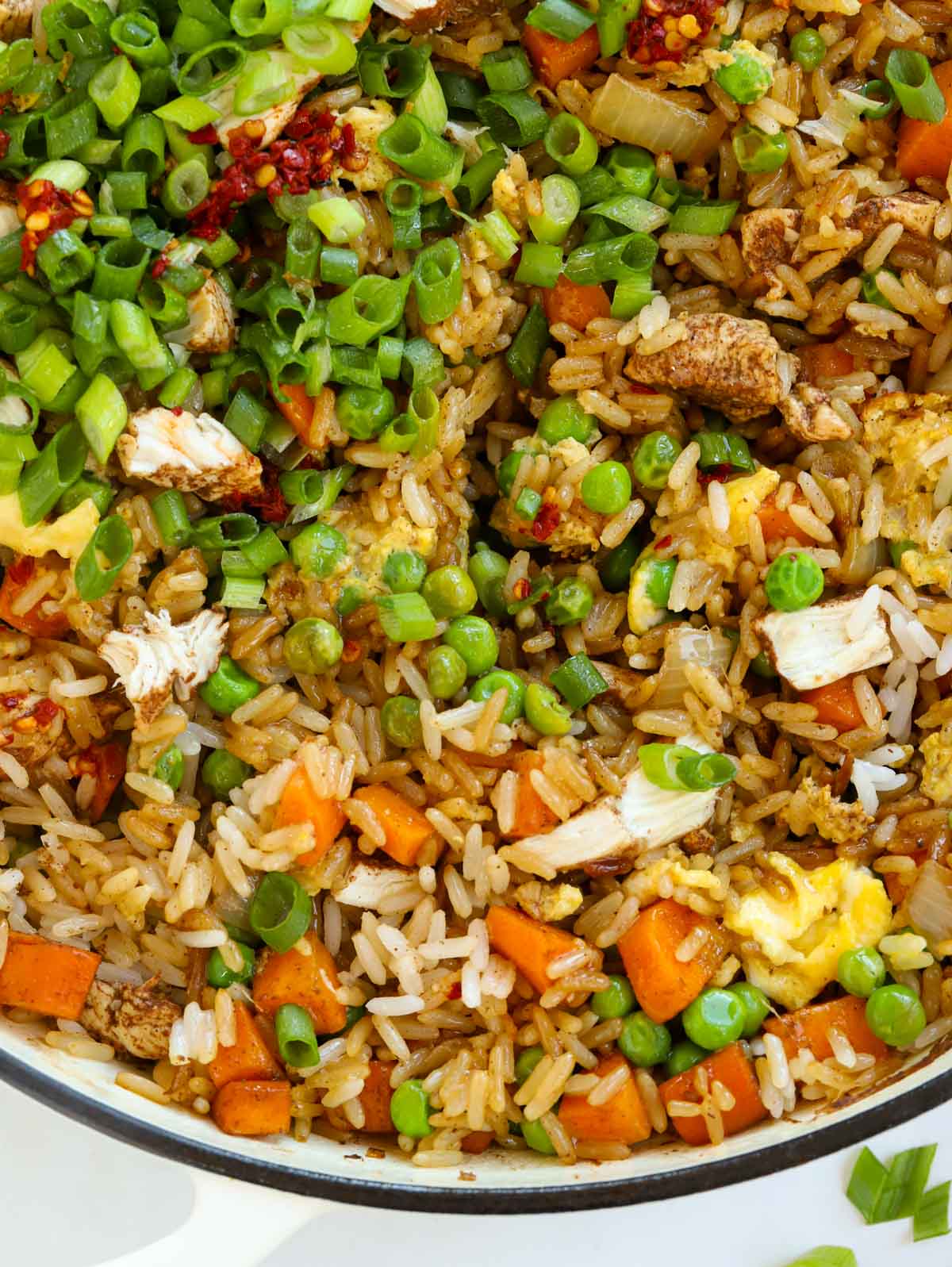 vegetables, chicken and rice mixed together to make a egg chicken fried rice meal.