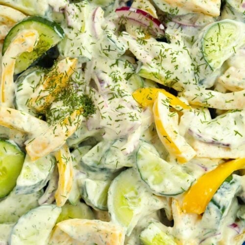 Close up of cucumber salad topped with dill