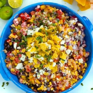 A big bowl of Mexican Salad topped with feta and tortilla chips.