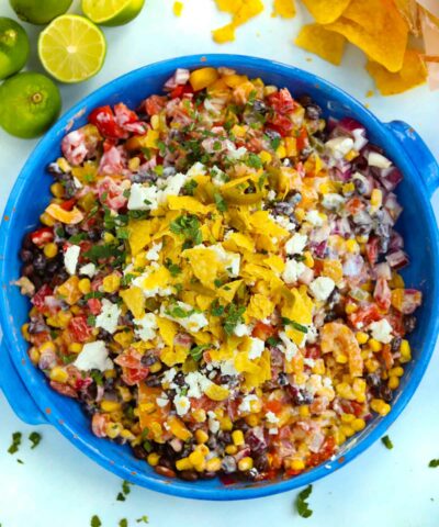 A big bowl of Mexican Salad topped with feta and tortilla chips
