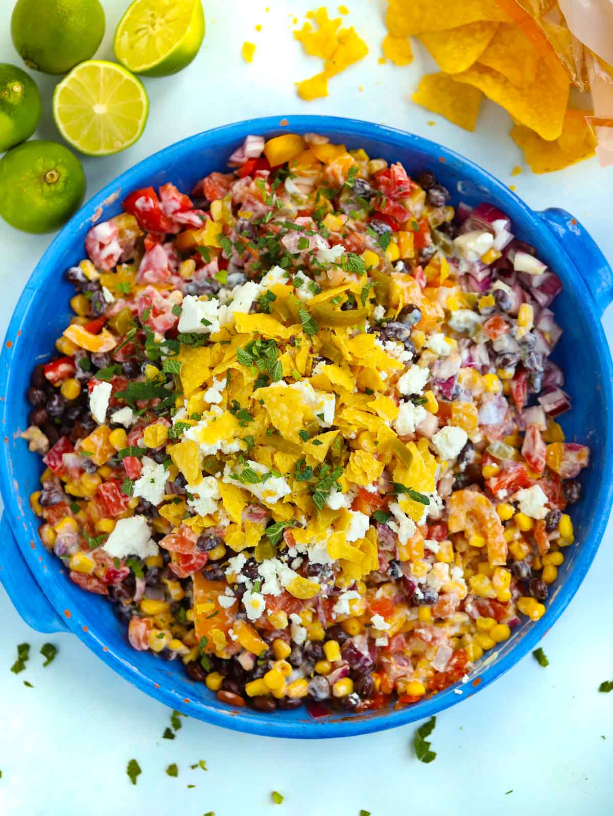 A big bowl of Mexican Salad topped with feta and tortilla chips