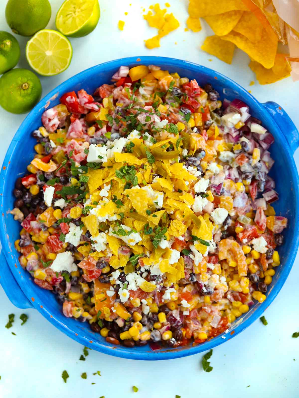 A big bowl of Mexican Salad topped with feta and tortilla chips.