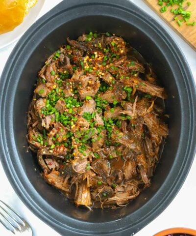 Beef brisket slow cooked in a slow cooker.