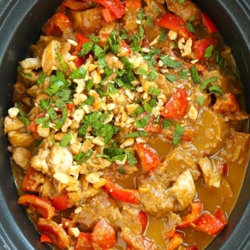 Slow Cooker Chicken Satay after it has been cooked with peppers and peanut butter.
