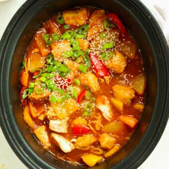 Peppers, chicken and spring onion in a sweet and sour sauce.